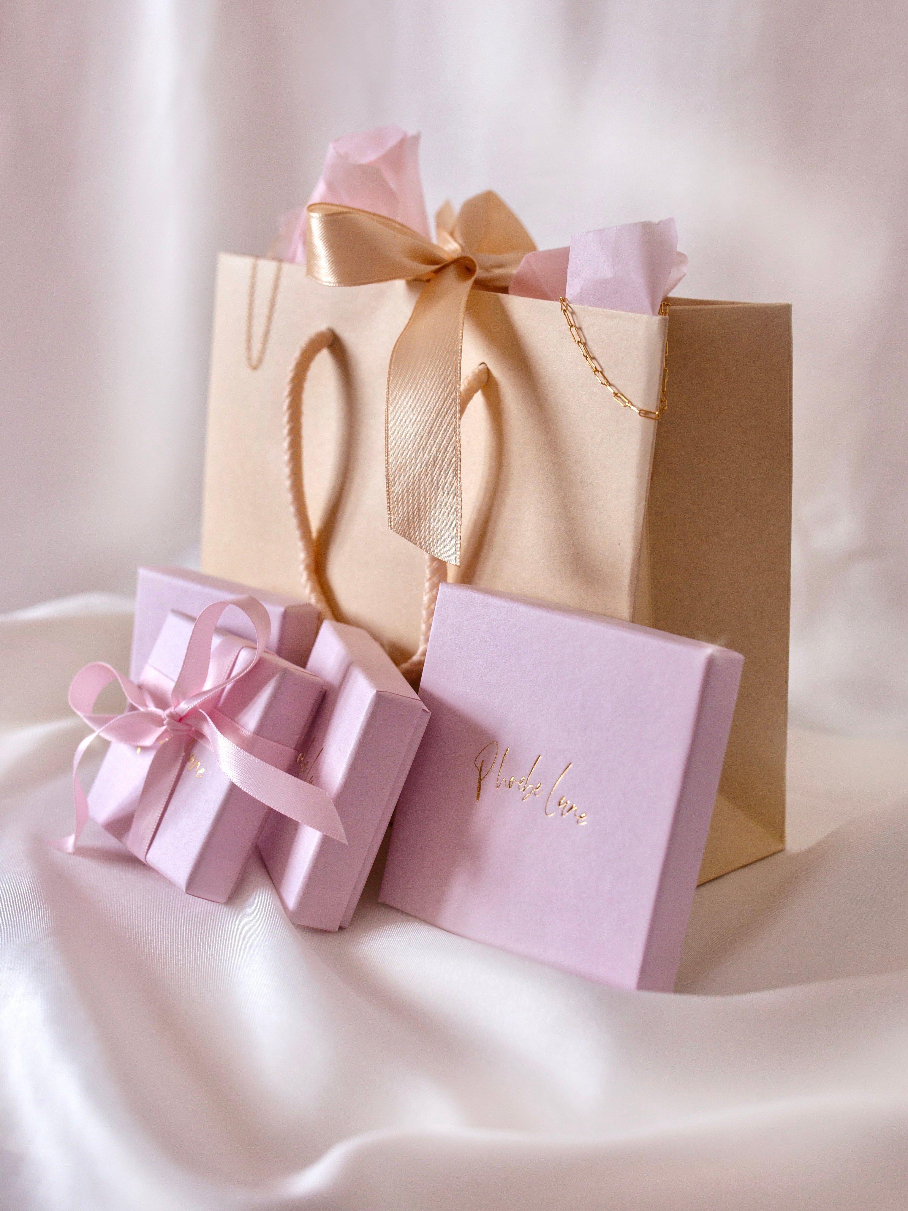Phoebe Lune Jewellery packaging recyclable bags in cream with pink boxes and ribbons